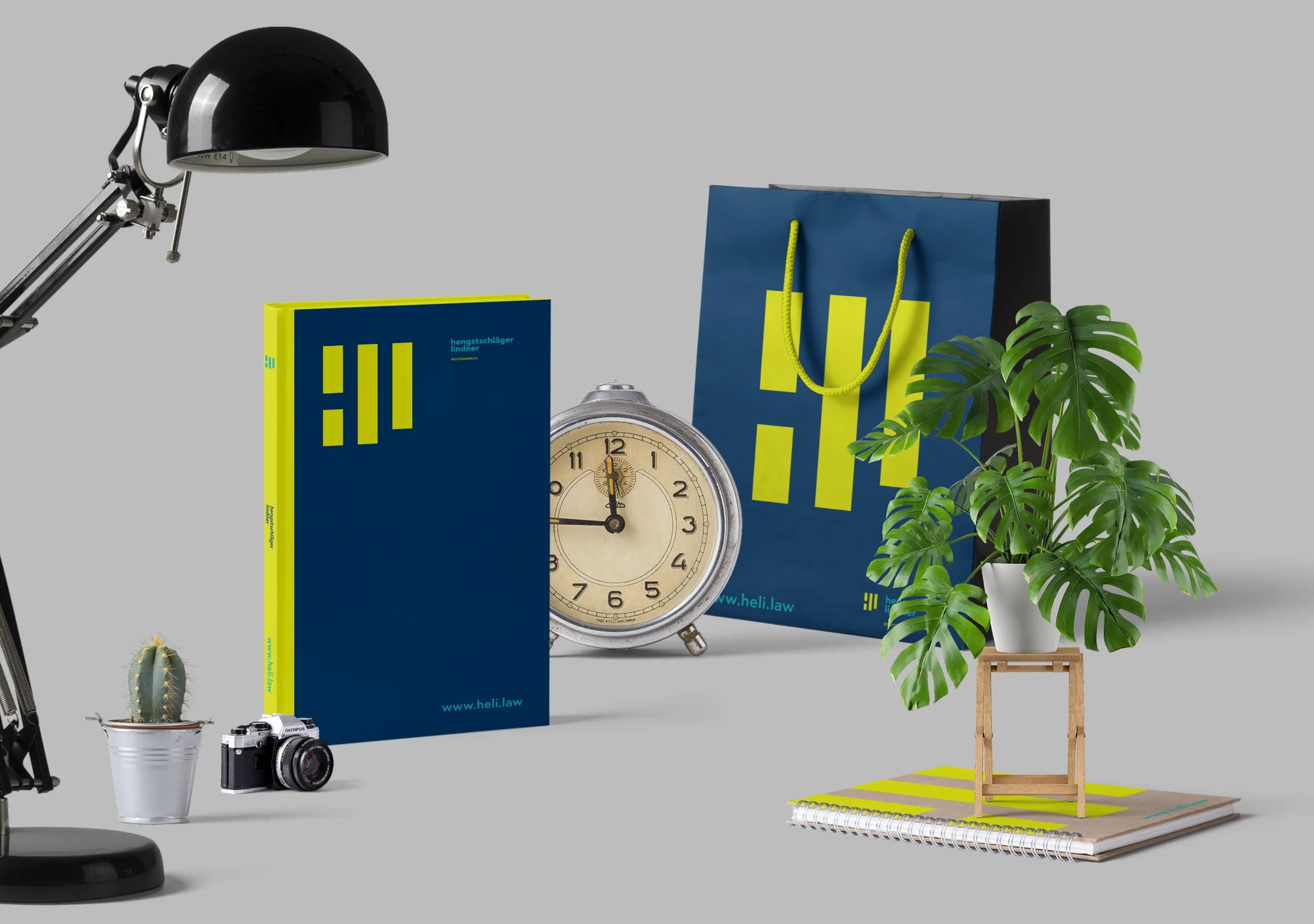 hengstschläger lindner corporate design on a book, tote bag and notebook